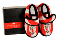 Pair of red and white striped kids slippers with Athletic Club Bilbao crest beside a black box.