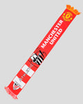 Red Manchester United scarf with bold white letters and club crest with fringed ends
