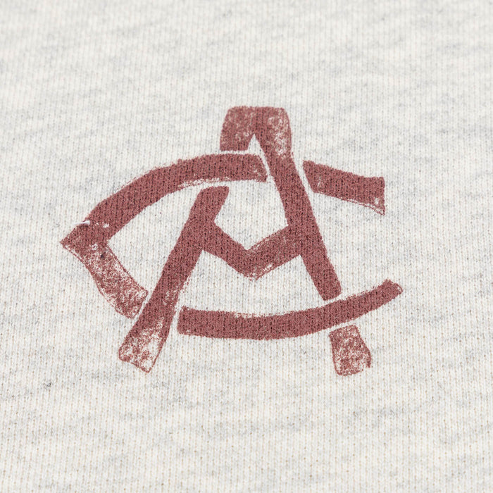Close up of heather fabric with a red AC Collection logo.