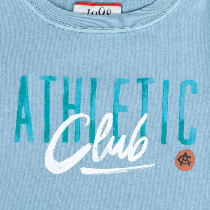 Close up of blue tee neckline and ATHLETIC Club print with teal lettering on soft cotton fabric.