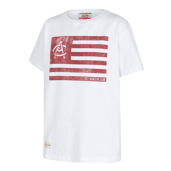 White Junior AC Collection Tee featuring a bold red flag stripe graphic on the chest.