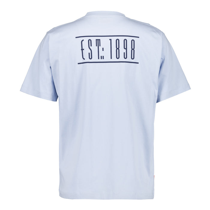 Camiseta azul claro vista trasera con EST 1898 entre barras