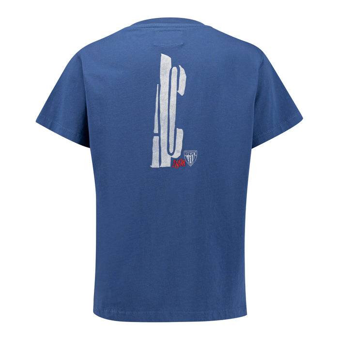 Blue junior cotton T shirt back view with tall white vertical graphic and small crest.
