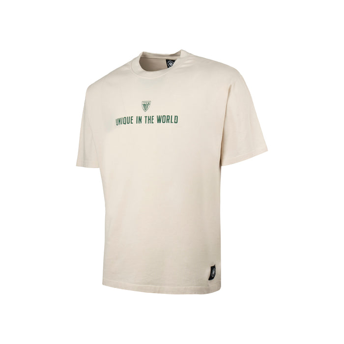 Beige junior short sleeve T shirt featuring a small green crest and Unique in the World across the chest.