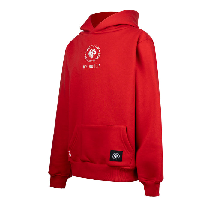 Red hoodie shown from the front with a small crest on the chest, kangaroo pocket and hem patch