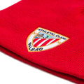 Close-up of red knit beanie showing the Athletic Club Bilbao crest