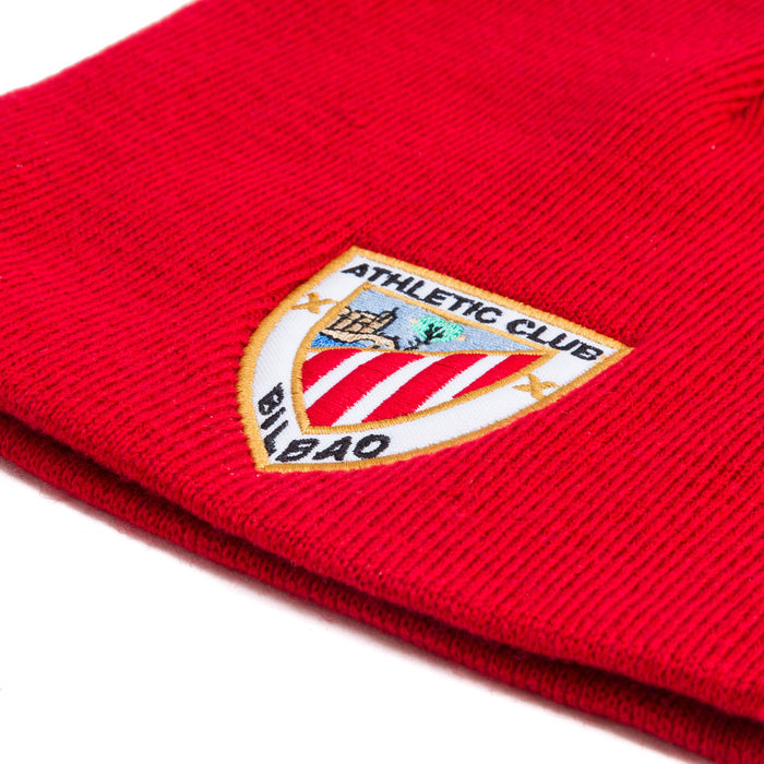 Close-up of red knit beanie showing the Athletic Club Bilbao crest