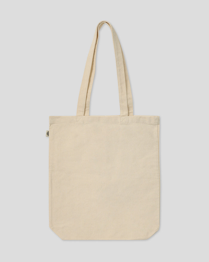 Beige canvas tote bag with two long handles shown from the front.
