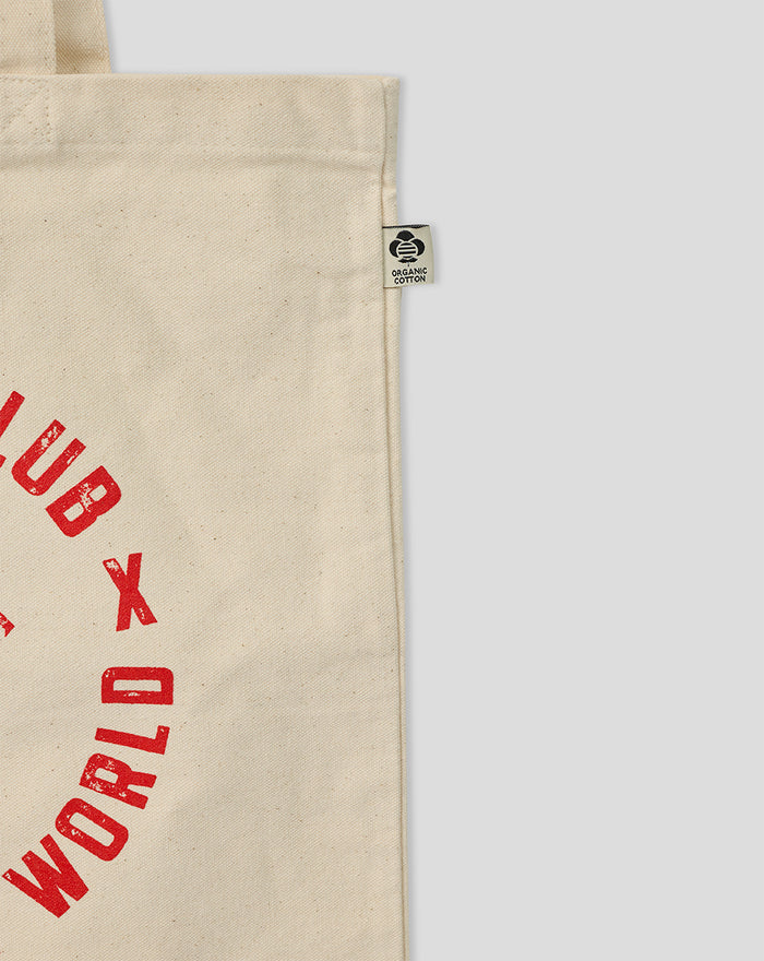 Close up of the tote bag edge with an organic cotton tag.