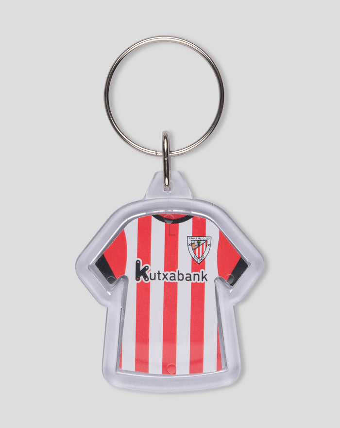 Reversible keychain featuring a red and white striped jersey with the Athletic Club Bilbao crest and sponsor Kutxabank.