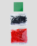 Football Brick Puzzle kit includes a green base plate and two bags of black and red bricks