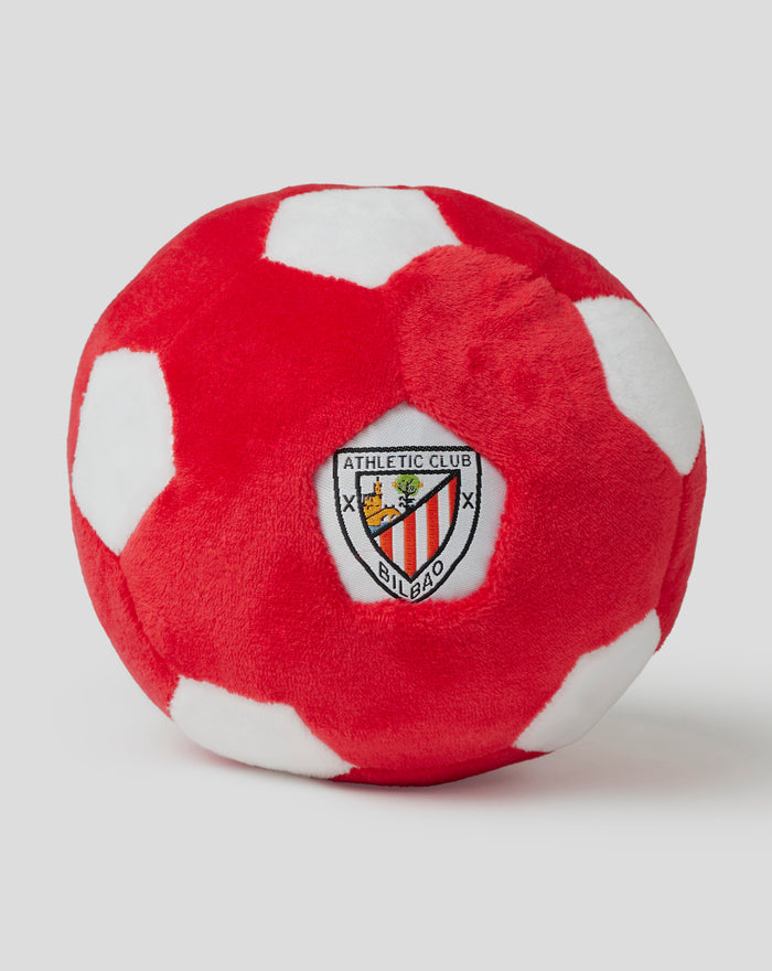 Pelota de juguete roja con parches blancos y el escudo del Athletic Club Bilbao.