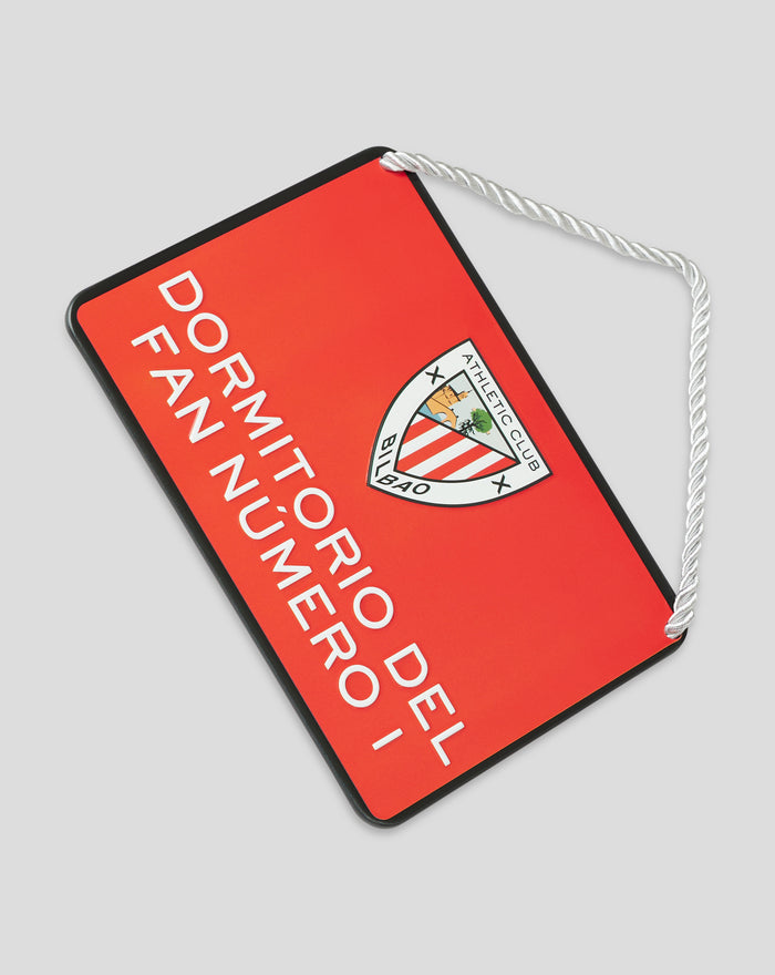 Red rectangular fan sign with black border and a white rope hanger featuring the Athletic Club Bilbao crest