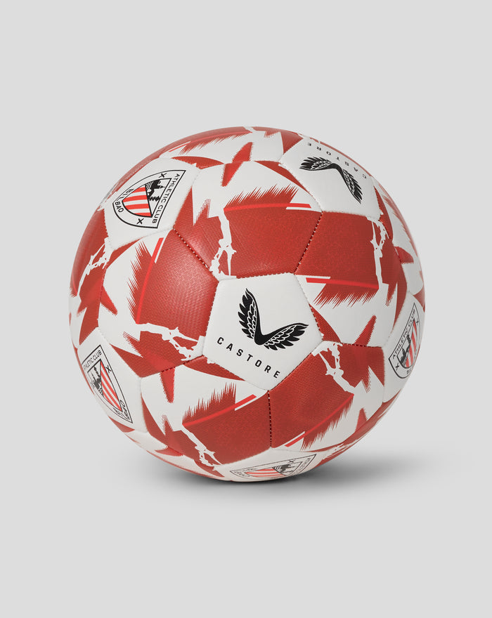 Close-up of Athletic Club Technic size 5 football showing red graphic panels and Bilbao crest