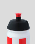 Close-up of the water bottle cap with a black lid and red push button