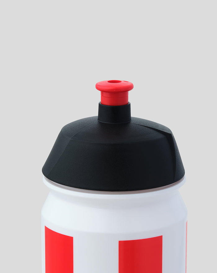 Close-up of the water bottle cap with a black lid and red push button