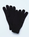 Close up of black knitted gloves showing crest patch on the cuff