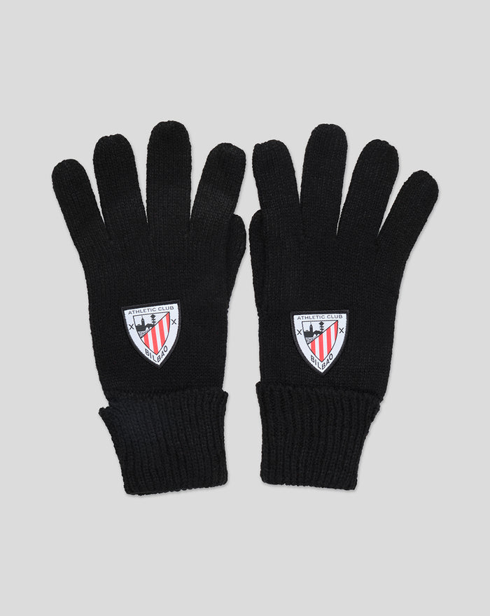 Pair of black knitted gloves with a crest patch on the back