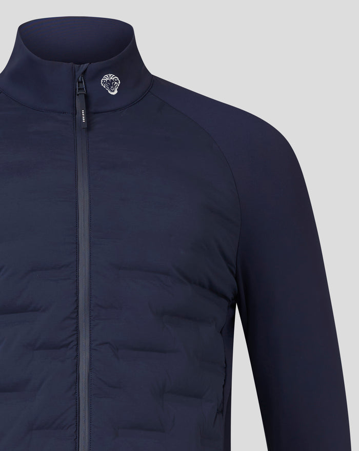 Close-up of navy athletic club hybrid jacket showing a stand collar, front zipper, and white logo on the collar.