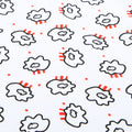 Close-up of all-over cloud pattern on white fabric with black outlines red stripes and small red stars.