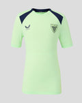Front view of lime green youth performance short sleeve tee with navy shoulder panels and crest.