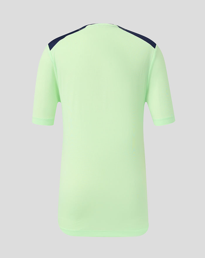 Back view of lime green youth performance short sleeve tee with navy shoulder panels.