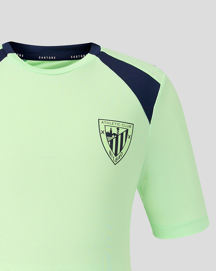 Neon green junior short sleeve athletic tee with navy shoulder panels and a crest on the left chest