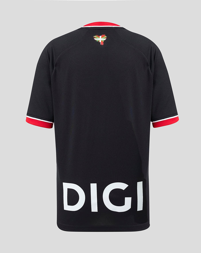 Back view of black away junior football jersey with red sleeve cuffs and a large DIGI print across the back, Basque flag at the neck