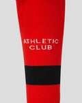 Close up of red sock with white Athletic Club text and black stripe near the cuff