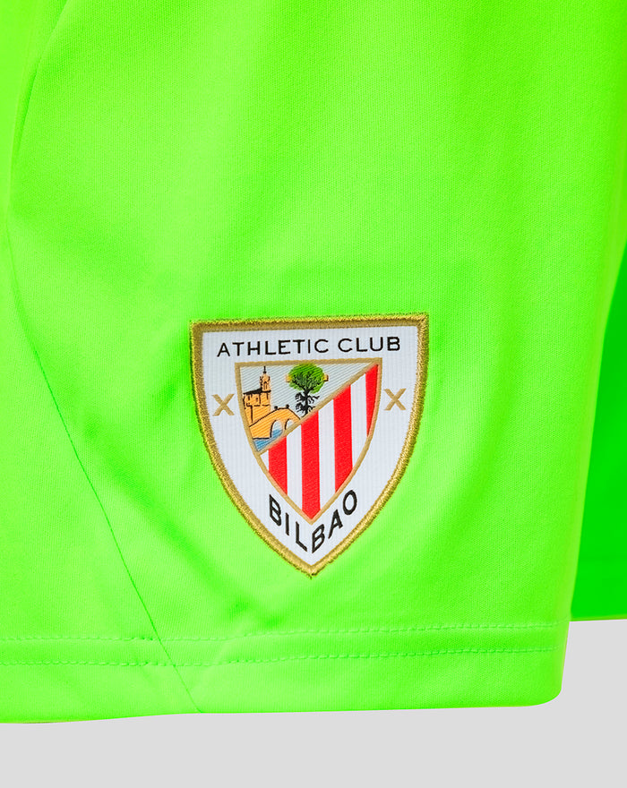 Close up of neon green goalkeeper shorts with Athletic Club Bilbao crest patch near the hem