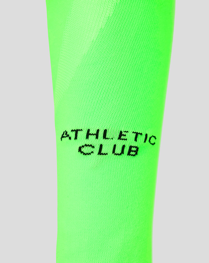 Neon green junior goalkeeper sock with black Athletic Club text logo on the calf.