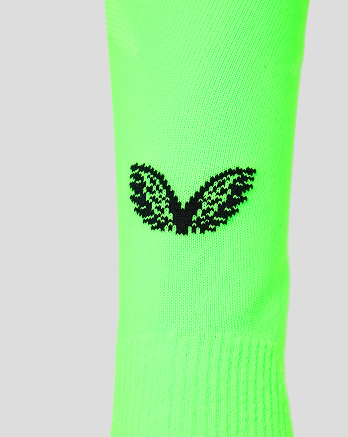 Neon green junior goalkeeper sock close up showing a black winged logo on the calf.