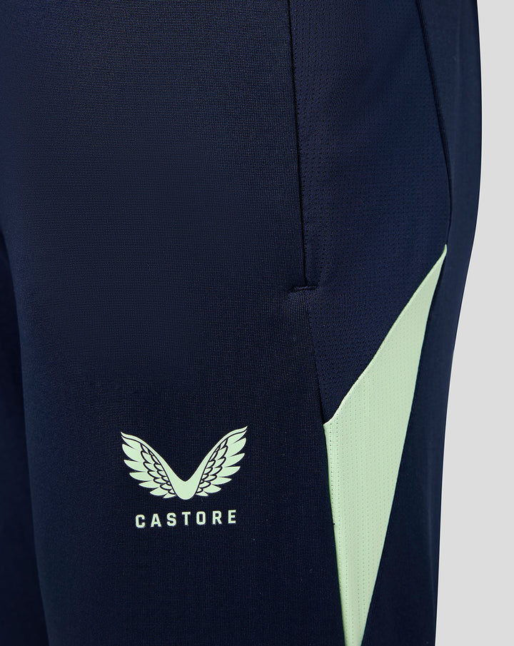 Junior navy performance pants with pockets, mint side panel and Castore logo