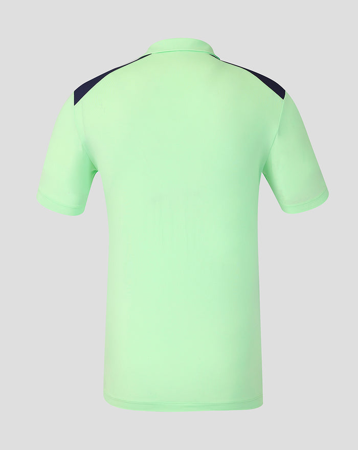 Back view of neon green performance polo shirt with navy shoulder panels