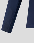 Close up of navy performance midlayer top sleeve with cuff and seam details