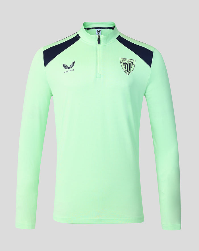 Neon green performance midlayer top with navy shoulder panels and crest emblem on the chest