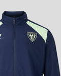 Close up of navy jacket chest showing full front zipper and crest badge on left chest