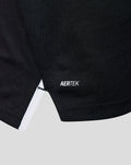 Close up of black Away Pro short sleeve shirt fabric with AERTEK logo at the hem