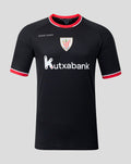 Front view of black away short sleeve shirt with crest and Kutxabank logo and red collar trim