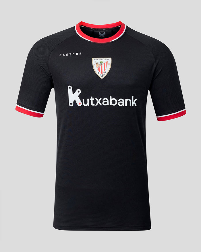 Front view of black away short sleeve shirt with crest and Kutxabank logo and red collar trim