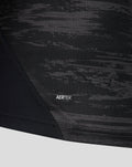 Close up of black camo fabric with AERTEK label on the home goalkeeper shirt