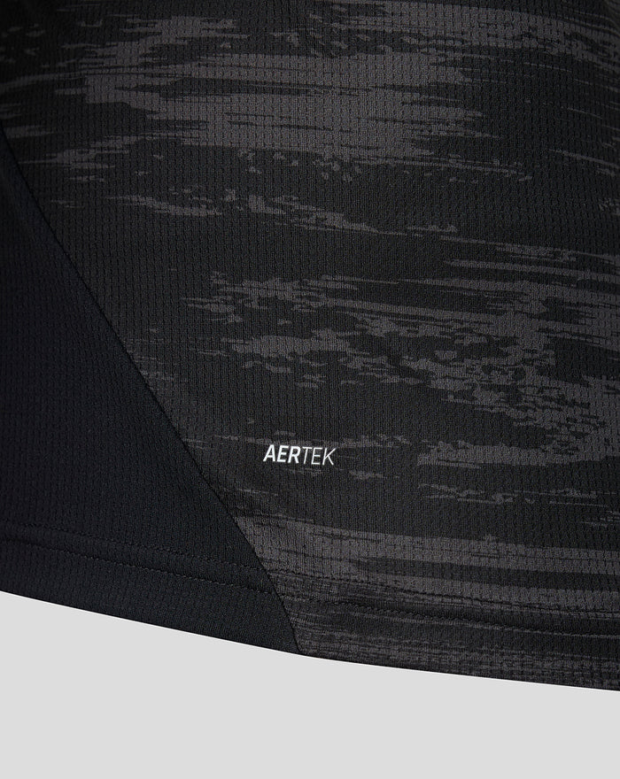 Close up of black camo fabric with AERTEK label on the home goalkeeper shirt