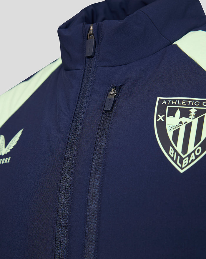 Navy performance gilet with crest emblem on the chest and front zipper.