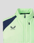 Close-up of neon green gilet collar and chest showing a zip pocket and Castore logo on the left chest