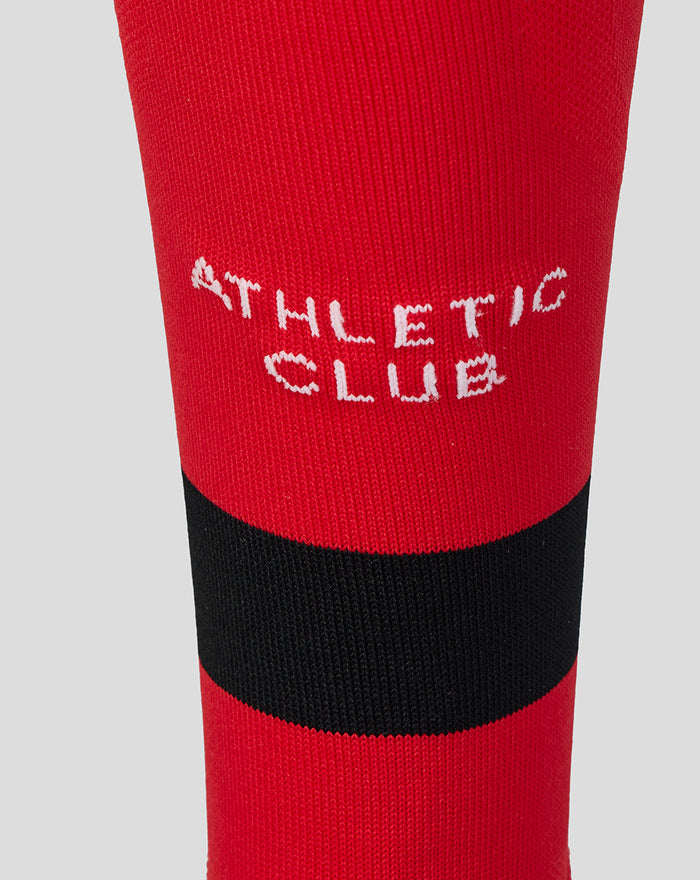 Close up of red Away Change sock with black band and white Athletic Club lettering