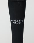 Close up of black Home goalkeeper sock with white Athletic Club lettering on the lower leg.