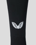 Black Home goalkeeper footless sock with a white winged emblem on the calf.