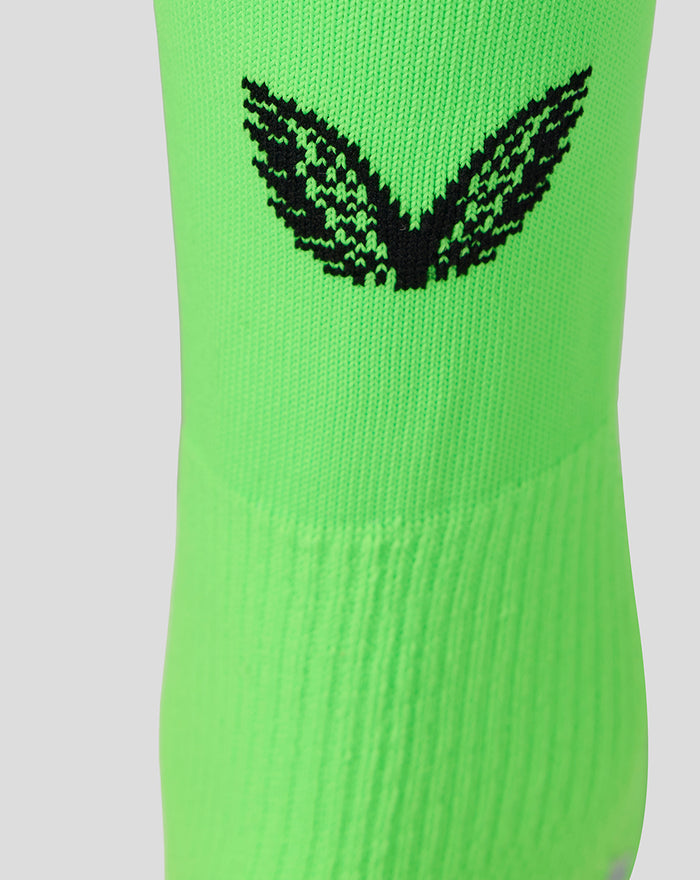 Neon green goalkeeper sock featuring a bold black wing emblem.