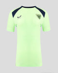 Neon green women's short sleeve performance tee with navy shoulder panels and crest logo on the chest