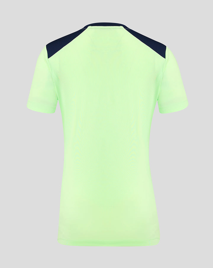 Back view of neon green women's short sleeve performance tee with navy shoulder panels
